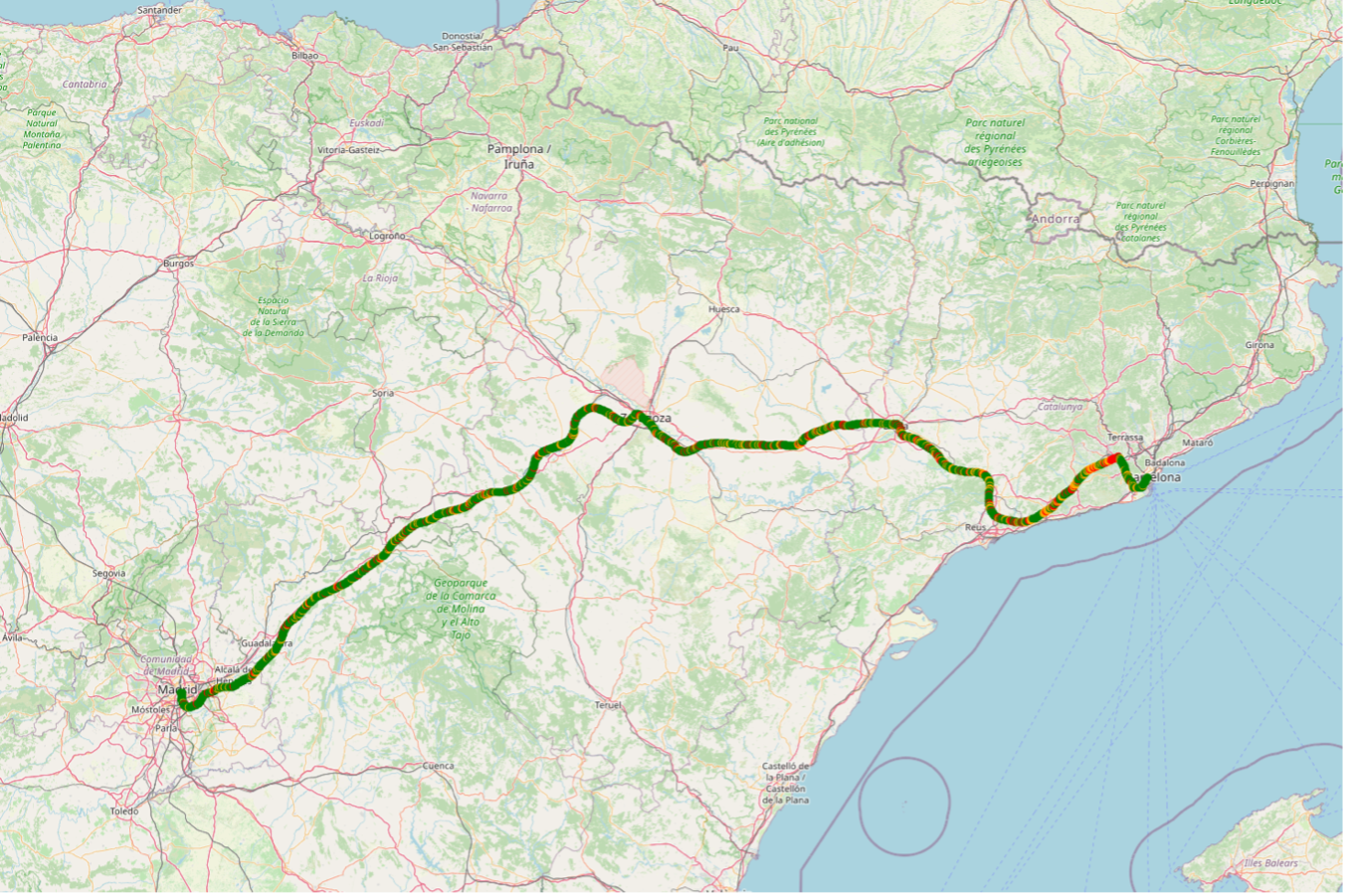 A map of north-eastern Spain with the Madrid–Barcelona railway line coloured by vibration severity, mostly green with amber and red segments