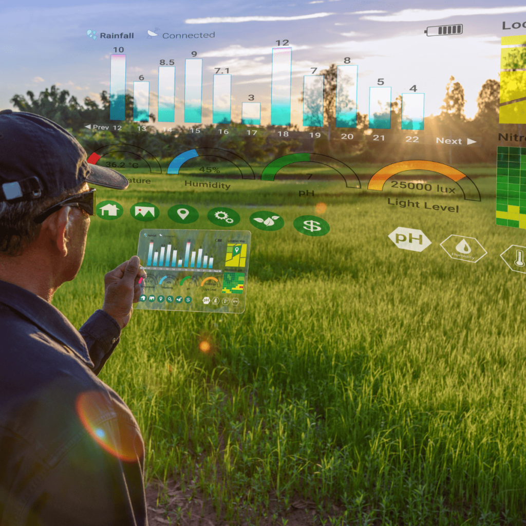 A farmer in a cap looks over a green field at sunset while a transparent tablet and floating charts show rainfall, humidity, pH and light level readings