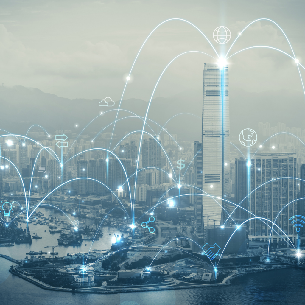 An aerial view of a coastal city skyline with glowing arcs of light linking buildings, and network icons floating above
